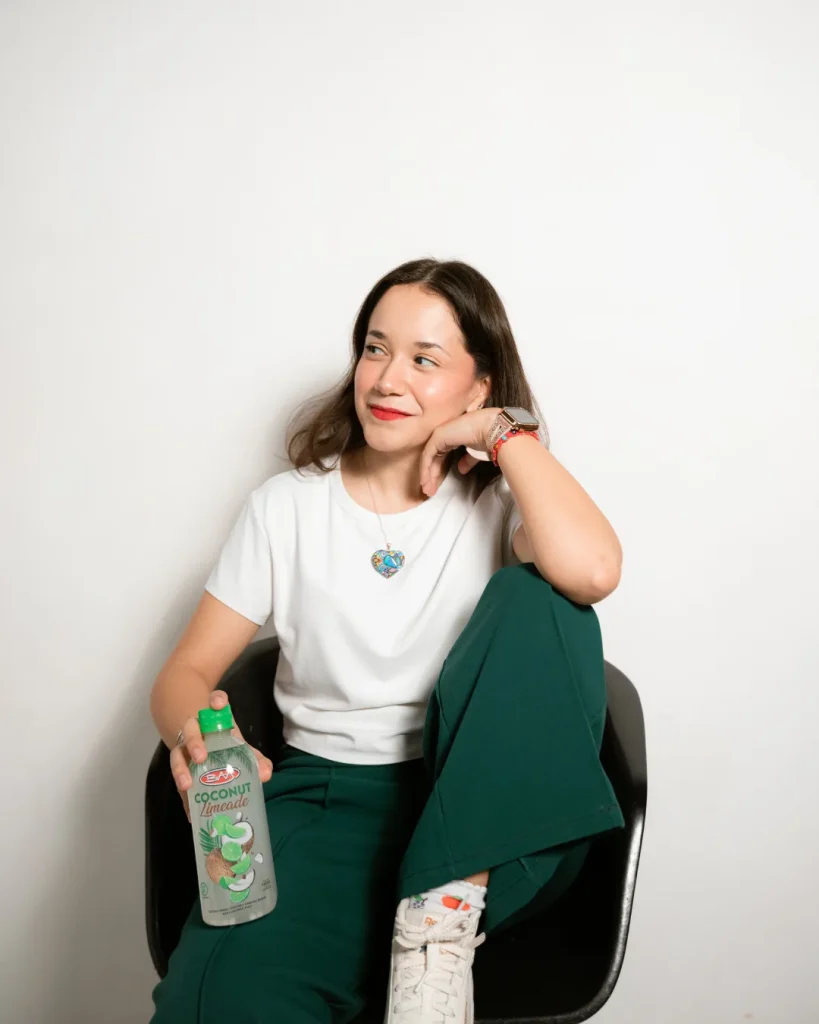 Studio portrait with a coconut drink