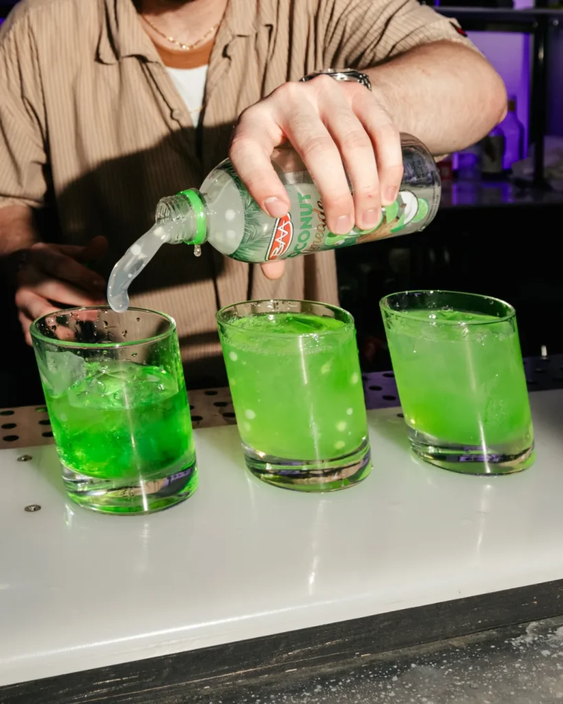 Product action shot pouring green drinks