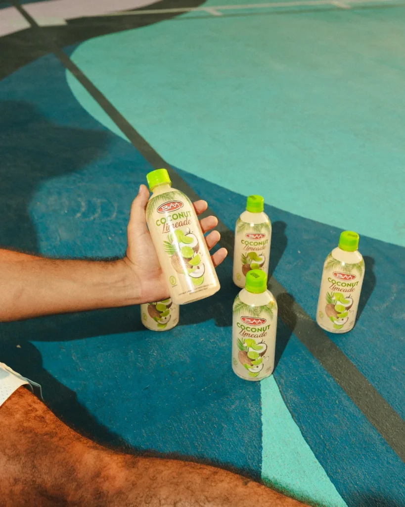 Product photography of drink bottles by the pool