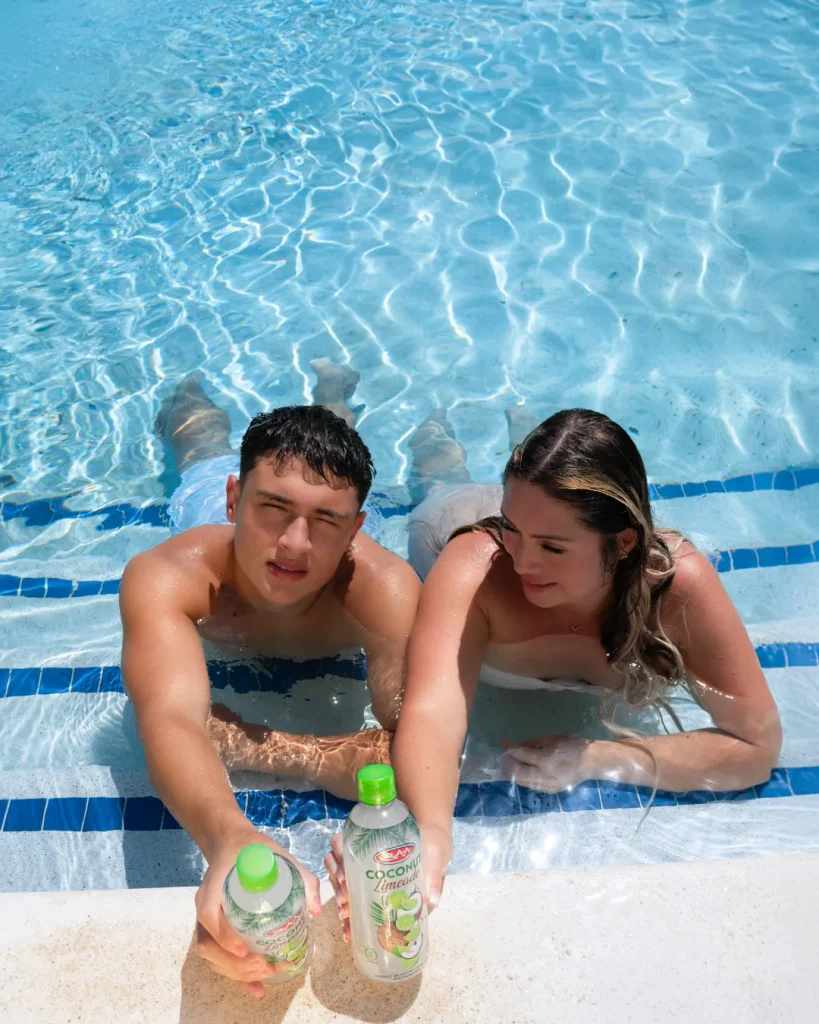 Lifestyle photo shoot in the pool with drink bottles
